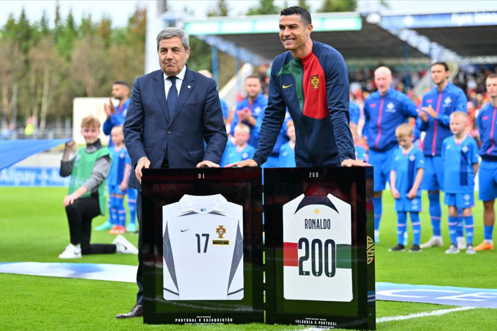 Cristiano Ronaldo holding golden commemorative cap number 200 for Portugal national team