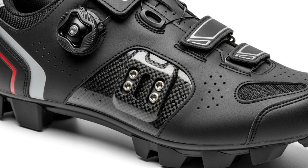 Close-up of wear-resistant bike shoe showing quality construction and cleat mounting reinforcement
