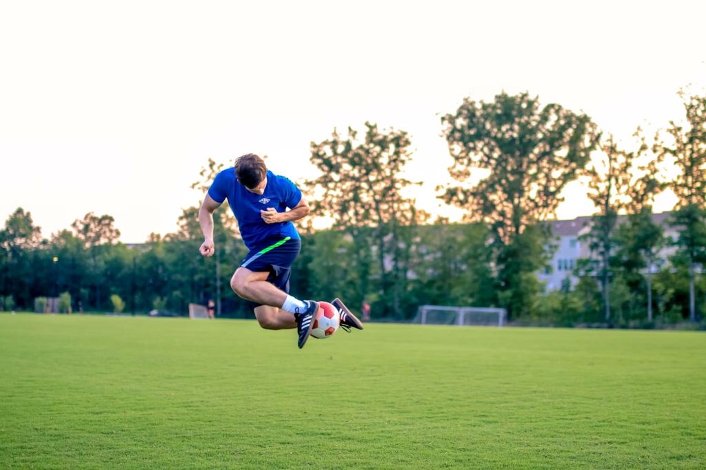 Soccer player practicing dribbling drills to improve ball control and speed