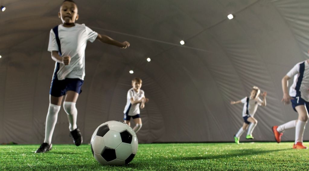 Team training session focused on precise passing techniques in soccer practice